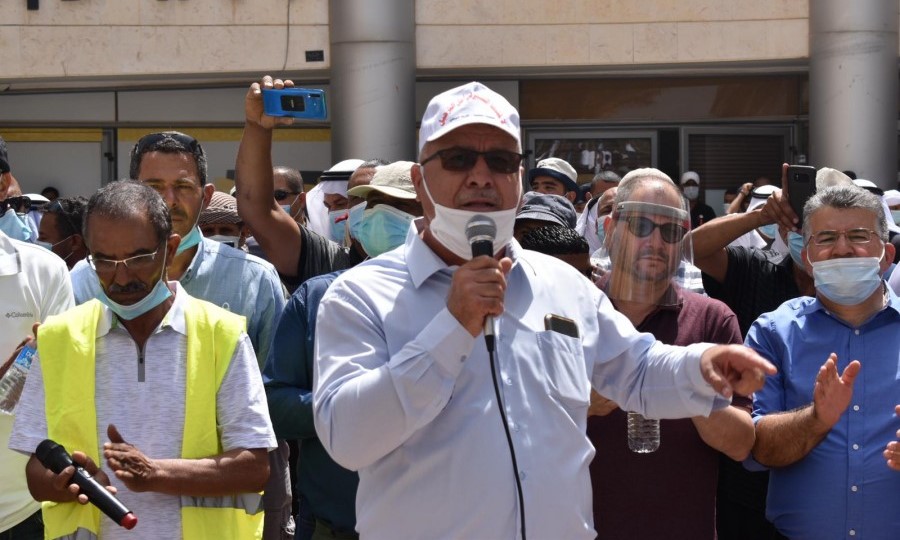 Head of the High Follow-Up Committee for Arab Citizens in Israel, Mohammad Barakeh (center), addresses the protesters gathered in Be'er-Sheva last Monday. At the extreme right of the picture is Hadash MK Yousef Jabareen and next to him MK Ofer Cassif.