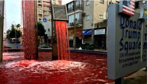 Peace activists turned the water in the fountain at Trump Square red in the Israeli city of Petah Tikva on Monday, June 29, to protest the Netanyahu government's intention to annex parts of the West Bank. Graffiti scrawled at the base of the fountain read "Annexation will cost us blood."