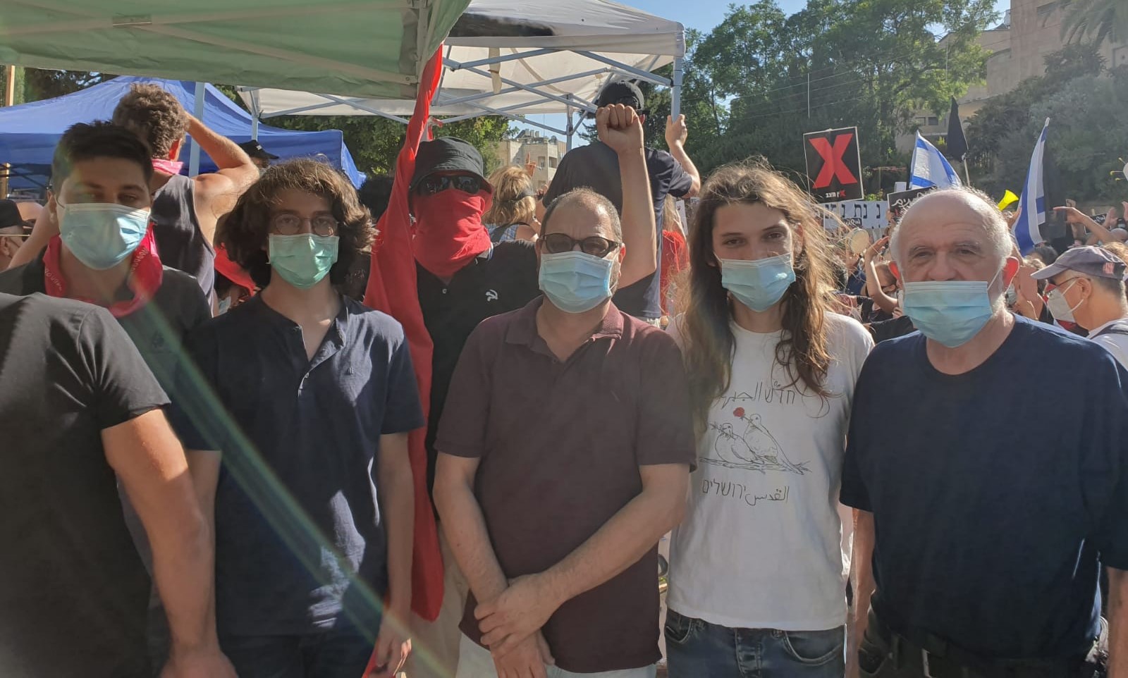 Hadash activists were among the many who attended the Friday, July 17, demonstration outside the Prime Minister's Official Residence in west Jerusalem demanding the resignation of Benjamin Netanyahu; in the center, Joint List MK Ofer Cassif.