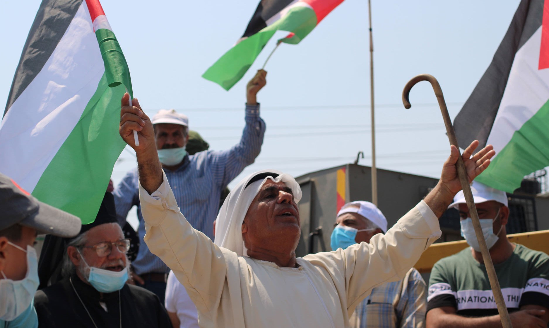 Palestinians protest on September 12 against Israeli occupation and colonization at the entrance to the occupied West Bank village of Hares. Weekly protests have been held in Hares since May, following an incident in which settlers destroyed hundreds of trees on land belonging to residents. Each week, soldiers close the gate to the village, preventing residents from marching to their land.