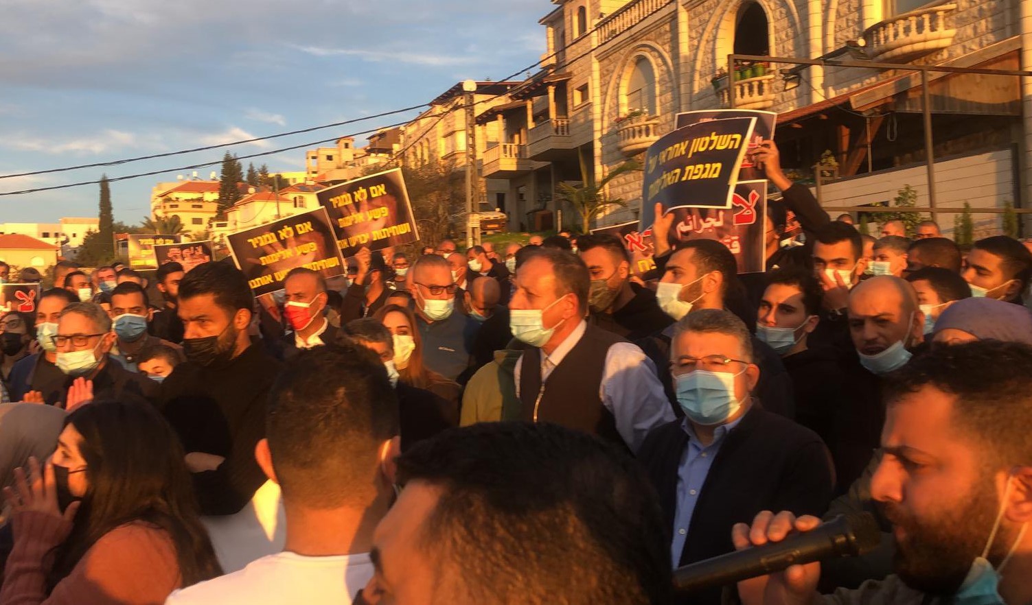 Hundreds of protestors marched in Umm al-Fahm a day after the serious wounding of the former mayor of the city, Dr. Suleiman Aghbariah, on Thursday, January 7. Among the protestors was Hadash MK Youssef Jabareen (second from right, wearing glasses) a resident of the city.