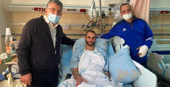 Joint List MK Youssef Jabareen (Hadash), left, who was injured by police during last Friday's protests in Umm al-Fahm, visits two other injured protesters still being treated in Haifa's Ramban Hospital.