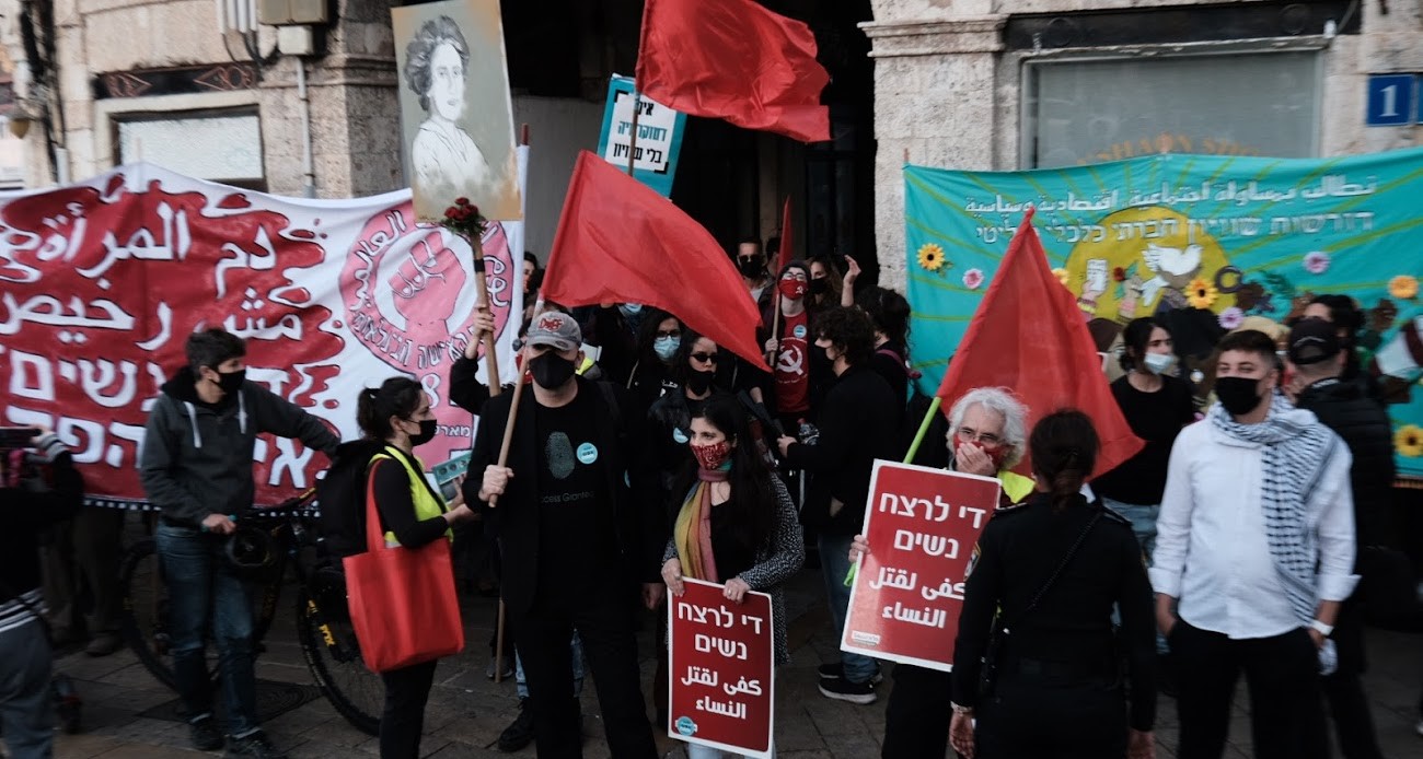 Demonstrators gather in Jaffa on Saturday, March 6, to commemorate today’s International Women’s Day. The two placards in the foreground read: "Enough murder of women"; the large banner to the left reads: "Women's blood is not cheap."