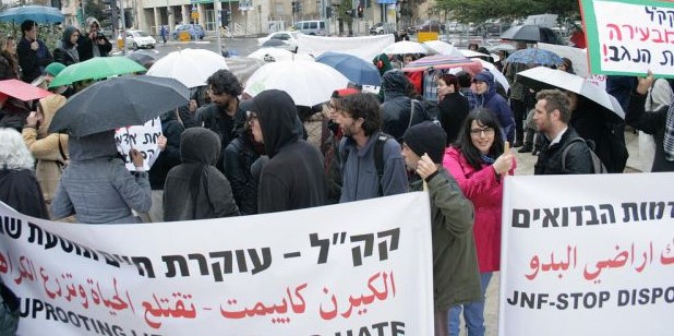 Outside the Jerusalem headquarters of the Jewish National Fund, demonstrators protest the planned eviction of Arab-Bedouin citizens of Israel from their lands in the Negev.