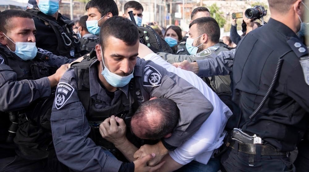 Joint List MK Ofer Cassif is violently restrained by police during the Friday, April 9 protest in occupied East Jerusalem's Sheikh Jarrah neighborhood.