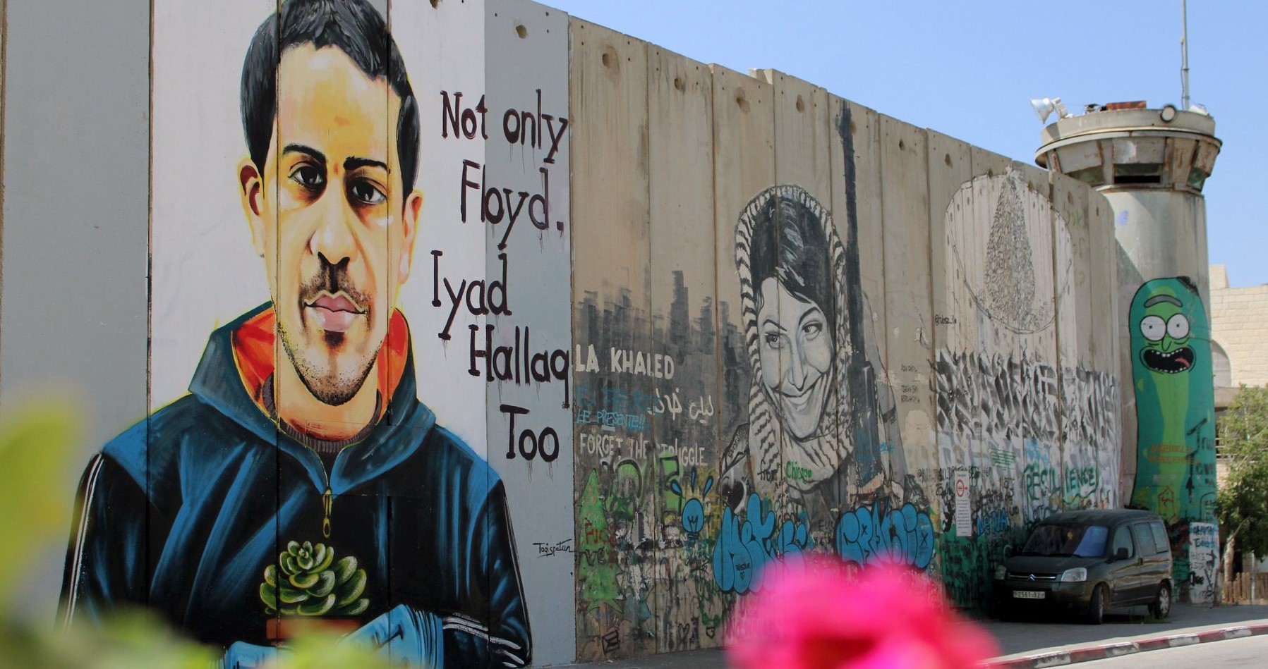 "Not only Floyd, Iyad Hallaq Too," a portrait of the 32-year-old autistic Palestinian man killed by Israeli police in occupied East Jerusalem in May 2020, rendered on Israel's "Apartheid Wall" separating Jerusalem and Bethlehem.