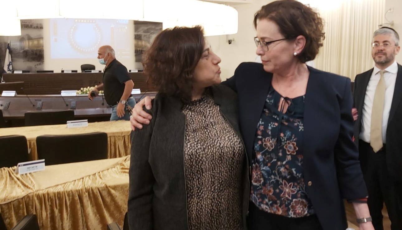 Shahira Shalabi (left), the new deputy mayor of Haifa, and Mayor Einat Kalisch-Rotem exhibit solidarity after a stormy city council meeting on Tuesday, May 4, 2021.