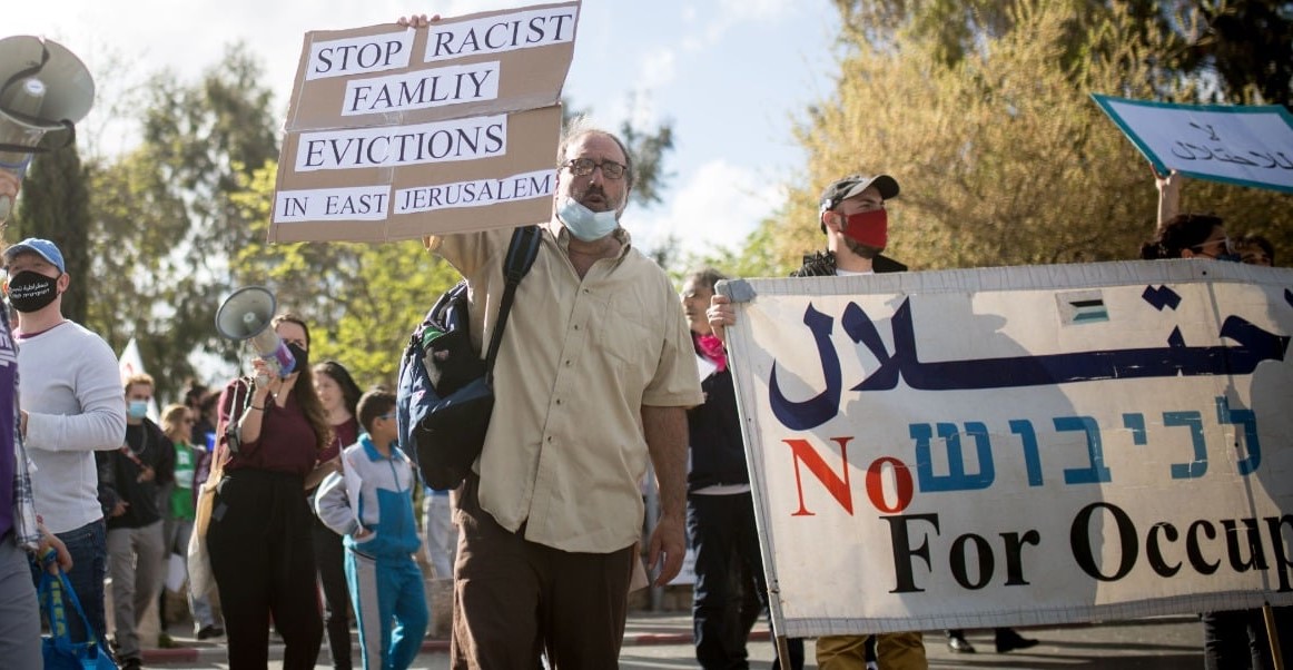 Palestinians and Israelis jointly demonstrate in Sheikh Jarrah against the eviction of long-time Palestinian refugee families from their occupied East Jerusalem neighborhood, April 10, 2021.
