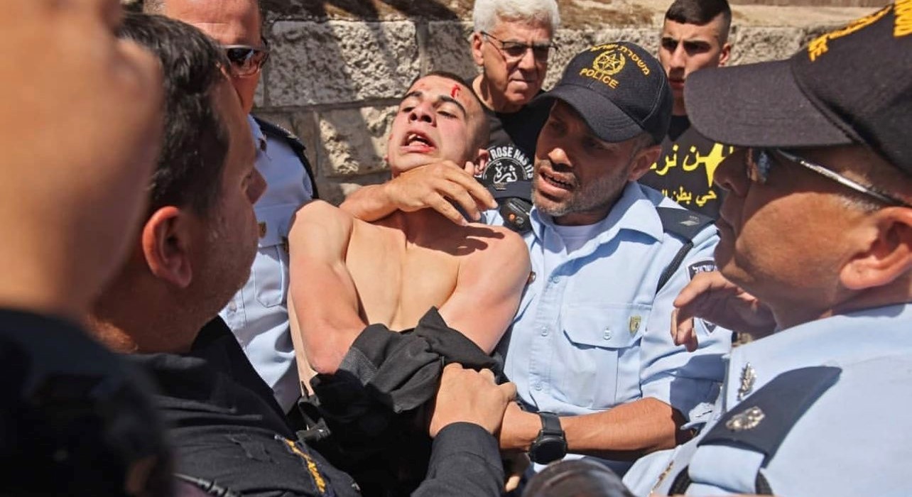 A Palestinian protester is forcibly arrested by Israeli police on Wednesday, May 26, near the Jerusalem District Court.