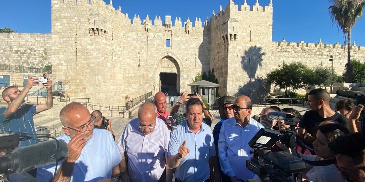 Joint List chair MK Ayman Odeh (Hadash, center) addresses the press conference held at the Damascus Gate (Bab al-Amoud) in occupied East Jerusalem prior to the jingoistic "Flag Parade," Tuesday, June 15, 2021.