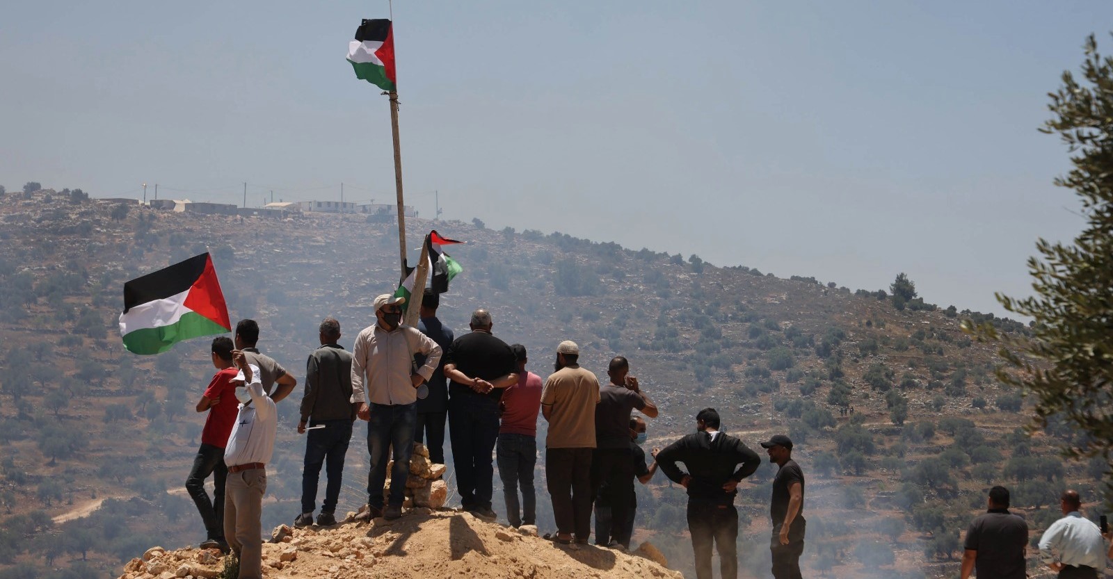Demonstrators from Beita hold their daily protest rally against the construction of Evyatar from atop Jabal Sabih, June 5, 2021.