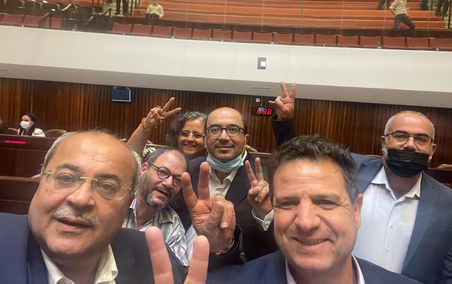 The Joint List's six MKs pose in the plenum for a picture commemorating the defeat of another annual extension to the "emergency measure" statue of Israel's racist Citizenship Law, Tuesday, July 6, 2021.