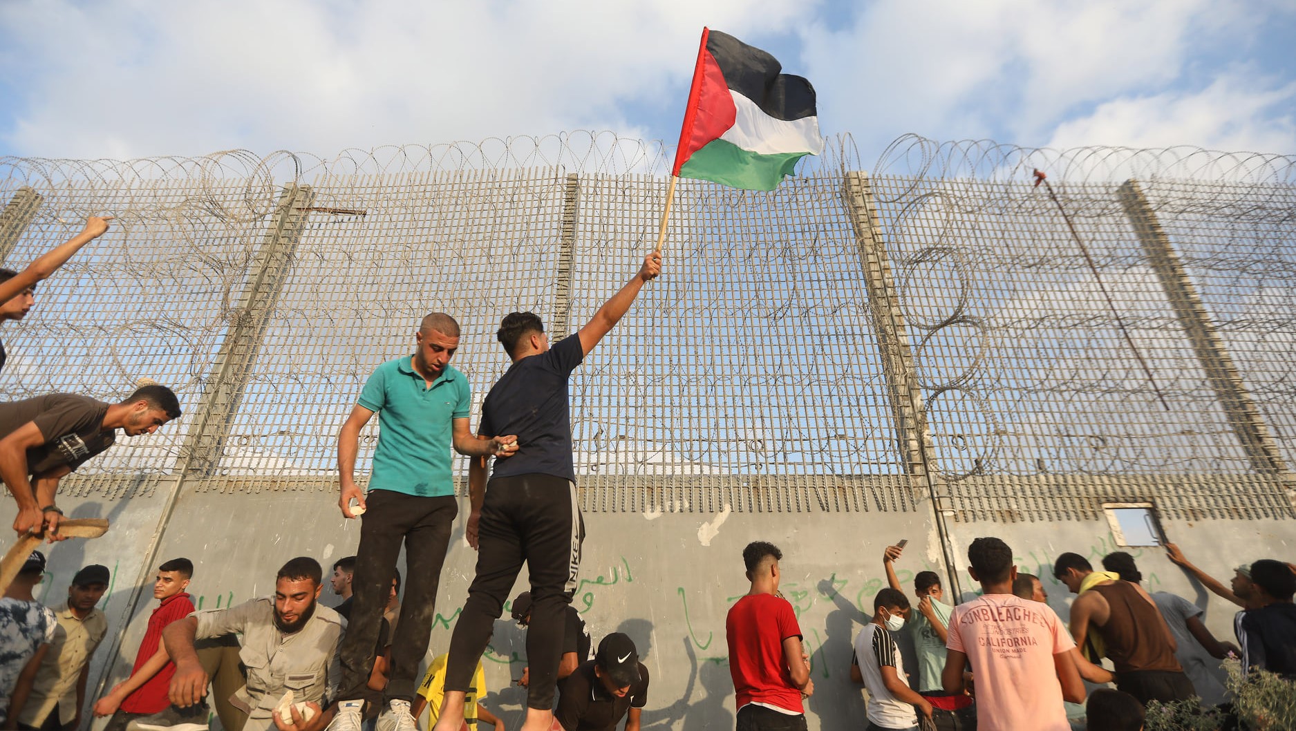 Palestinians along the border fence enclosing the Gaza Strip protest against the Israeli blockade that has been in place for over 14 years (Saturday August 21). Israeli soldiers responded with live fire, injuring 41 protesters, including critically injuring a 13-year-old. An Israeli Border Police sniper was also critically injured while positioned on the other side of the fence.