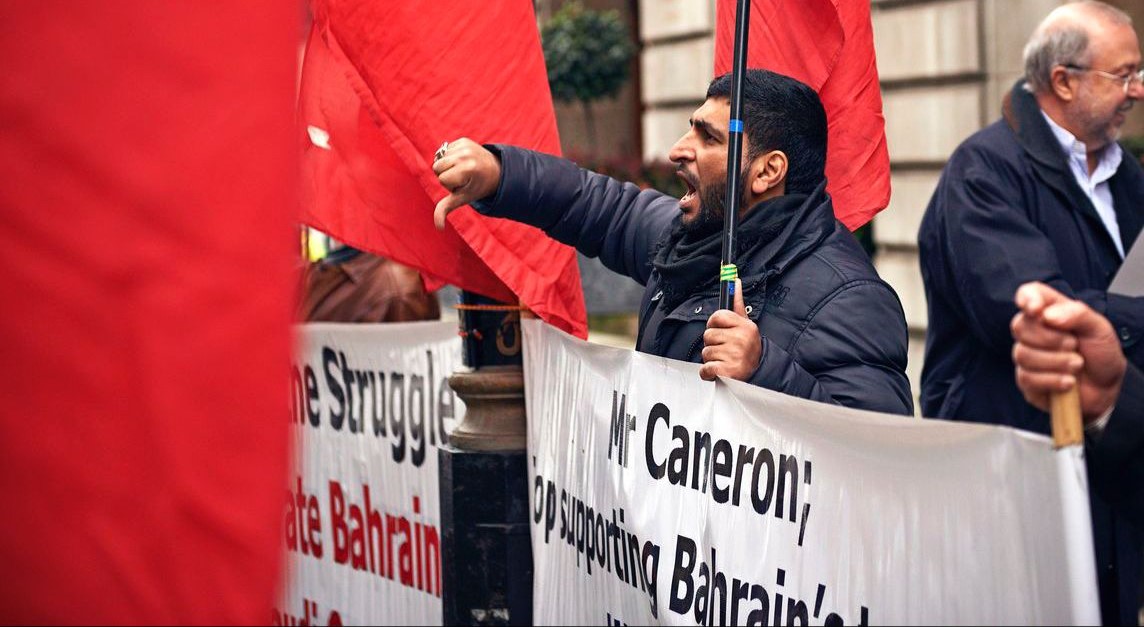 Hacked Bahraini activist Mousa Abd-Ali protesting in front of the Bahraini Embassy in London