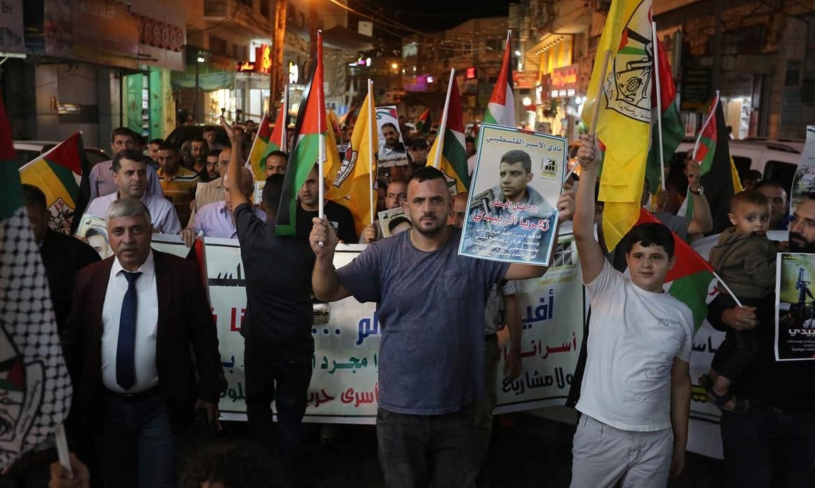 Palestinians demonstrate in Hebron Wednesday night, September 8, in solidarity with their incarcerated brethren.
