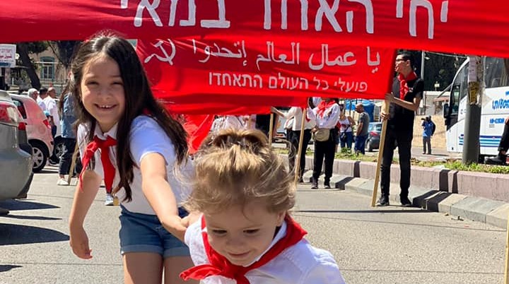 May Day parade in Nazareth, May 1, 2021. The red banner reads: "Long live the 1st of May. Workers of the World Unite!"