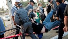 An activist being arrested by Israeli police during the demonstration in support of Palestinian hunger-striking prisoners in front of Ramle Prison, Israel, on May 3, 2012