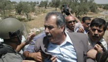 The occupation army against MK Barakeh, Bil'in 2005 (Photo: Al Ittihad)