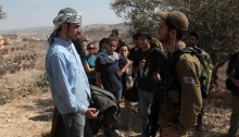 A Palestinian activist argues with an Israeli soldier after he prevented a Palestinian family and their supporters to harvest 5 olive trees in the West bank village of Kafr Qalil near a spring confiscated by the settlers of Har Bracha. October 23, 2012