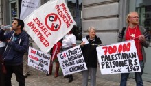 Dozens of activists took to the streets in Brussels on June 26 2013, to inform people in the area around the European institutions about G4S’ complicity in the occupation of the Palestinian territories (Photo: Al Ittihad)