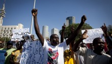 Sudanese refugees protest in front of the government's offices in center Tel Aviv, against the plan to imprison refugees, October 14, 2012