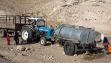 Water truck at Khirbet Jenbah, South Hebron Hills. Village is not hooked up to water grid (Photo: Activestills)