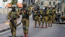 Israeli occupation forces in Hebron (Photo: Activestills