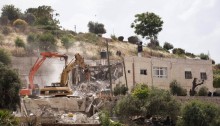 Caterpillar bulldozers are seen demolishing a residential home in the Jabal Mukabbir neighborhood in east Jerusalem, May 21, 2013. The home was demolished on the grounds that it was built without a "legal building permit" (Photo: Activestills)