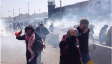 Dozens of Palestinian women suffered from excessive tear gas inhalation and lost consciousness as Israeli forces quelled a peaceful female rally, marking International Women’s Day, near the Qalandia checkpoint on Saturday, March 7, 2015.