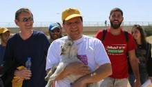 Joint List head Ayman Odeh (center) and MK Dov Khenin (left) march on a four-day trek starting from the unrecognized Bedouin villages in the Negev, March 26, 2015.
