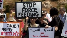 Protest against forced feeding of Palestinian prisoners, Jerusalem, June 16, 2014. Activists and doctors take part in a demonstration in front of the Knesset, organized by Physicians for Human Rights, against the bill to legalize forced feeding of hunger-striking prisoners in Israel.