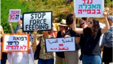 Protesters demonstrate against forced feeding of Palestinian prisoners, Jerusalem, June 16, 2014. Activists and doctors took part in a demonstration in front of the Knesset, organized by Physicians for Human Rights, against the bill to legalize forced feeding of hunger-striking prisoners in Israel.