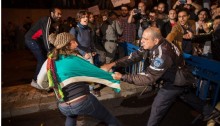 Police arrest an activist during a protest against the privatization of natural gas in Tel Aviv, November 7, 2015.