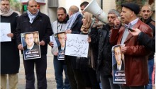 Palestinians demonstrate in solidarity with the journalist Muhammad Al-Qeeq, 33, who has been on hunger strike since Israeli forces arrested him from his home in November, Nablus, West Bank, December 31, 2015