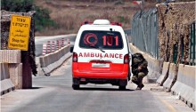 A Palestinian ambulance at an occupation army checkpoint