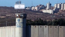 Israel's Ofer prison and military court situated in the OPT; in the background, Ramallah, controlled by the Palestinian Authority