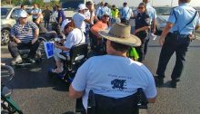 Wheelchair bound protesters at the Batzra Interchange on Route 4 on Sunday morning, July 9