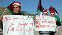 Palestinians at the Huwwara checkpoint demonstrate against unaccountable military violence. The sign in Arabic reads: “It is our children’s right to live like all the other children of the world.”