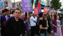 MK Dov Khenin (first from left) during the protest in Tel Aviv Sunday evening, outside the party headquarters of the Likud