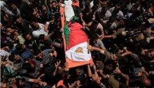 Yasser Abu al-Najja, 14, is brought to burial in Khan Yunis in the southern Gaza Strip, June 30, 2018. The youth was killed Friday by a bullet to the head fired by an Israeli sniper during a protest calling for the right of return and end to the siege of Gaza.
