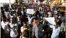 African migrants and supporters demonstrate against the "Deposit Law" in Tel Aviv.