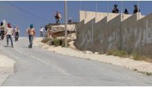 Hooded Israeli settlers assault 'Urif while military looks on, covering them, July 6, 2018