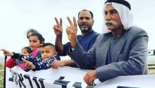 69-year-old Sheikh Sayekh Abu Madi'am al-Touri, right, and family members during a demonstration against the demolition of the Bedouin village of Al-Araqib, unrecognized by the State of Israel