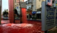 Peace activists turned the water in the fountain at Trump Square red in the Israeli city of Petah Tikva on Monday, June 29, to protest the Netanyahu government's intention to annex parts of the West Bank. Graffiti scrawled at the base of the fountain read "Annexation will cost us blood."