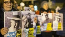 Peace activists protest outside the Russian compound police station in Jerusalem, calling to release the three anti-occupation activists then under arrest there: Ezra Nawi, Guy Butavia and Nasser Nawaja, January 21, 2015.