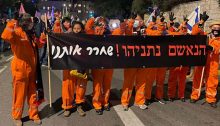 Protesters near Jerusalem’s Paris Square on Saturday, January 23, demonstrate against the continuing rule of far-right Prime Minister Benjamin Netanyahu. The sign reads: "The accused Netanyahu! Set us free."