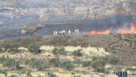 Israeli settlers light fires and hurl stones at a Palestinian home near the West Bank town of Burin on Saturday, October 16, 2021.