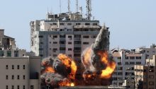 Al-Jalaa Tower in Gaza, which housed international media offices, only seconds before it was entirely toppled by an Israeli air strike on May 15, 2021