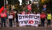 Under the banner “Human Rights are Not Terror,” Hadash and Communist activists protested outside the Ministry of Defense in Tel Aviv on Tuesday evening, October 26, against Israel’s decision to designate six Palestinian human rights and civil organizations as terrorist groups.