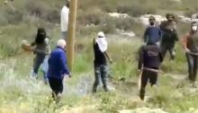 Masked Jewish settlers escorted by Israeli occupation troops assault a Palestinian man in the West Bank in a video released on April 3, 2021.